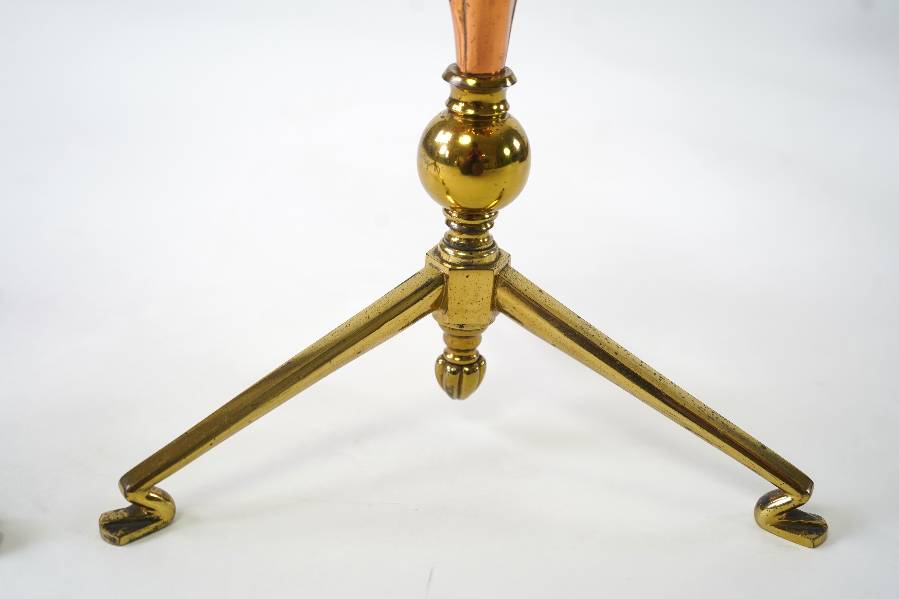 W.A.S. Benson & Co.: A pair of Arts and Crafts gilt brass and copper three branch candelabra